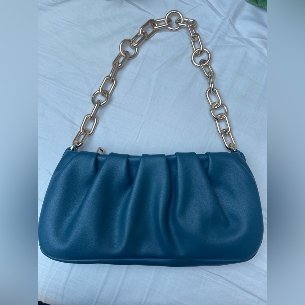 Blue purse with gold chain